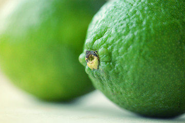 Two bright green limes close-up