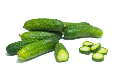 Fresh , green sliced cucumbers isolated on white background