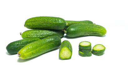Fresh , green sliced cucumbers isolated on white background