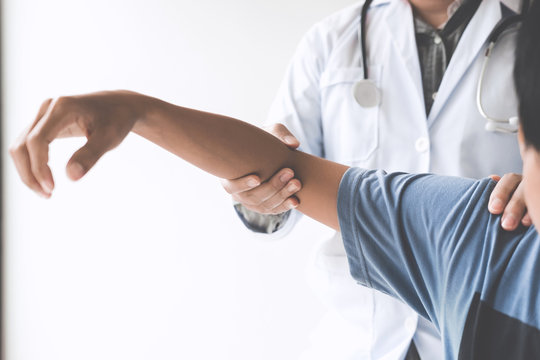 Doctor checking patient with elbow to determine the cause of illness