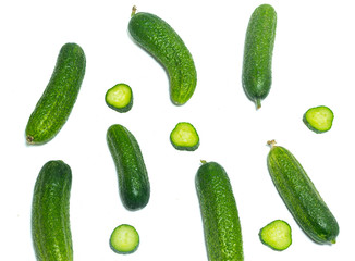 Fresh , green sliced cucumbers isolated on white background