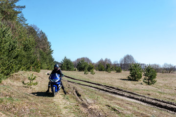 Obraz premium sport bike motorcycle on dirt road, off road, A bike driver, concept, active lifestyle, missed the turn, drove the wrong way, the navigator showed the wrong path