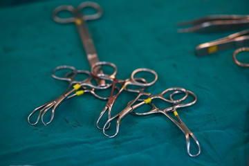 Surgical instruments on the green table in operating room