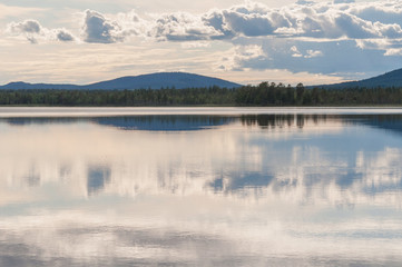 Clouds reflecting on mirrored lake