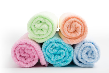 Obraz na płótnie Canvas pile of rainbow colored towels isolated
