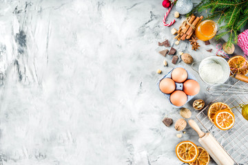 Christmas winter baking concept, ingredients for making cookies, baking, pies. Dried orange slices, spices,utensils, grey marble background copy space top view