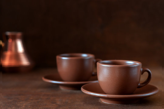 Coffee cups and copper Turk on the table
