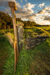 Obsolete small boats and barges were beached on the banks of the tidal River Severn in...