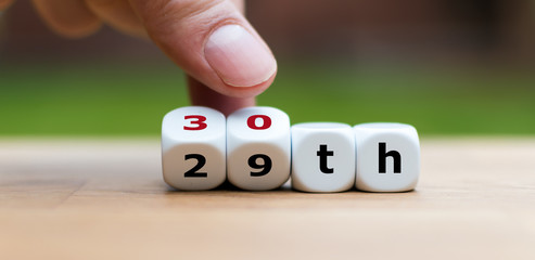 Hand turns dices and changes the number "29" to "30"