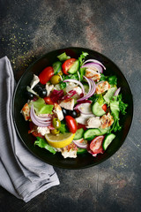 Vegetable salad with grilled chicken fillet.Top view with copy space.