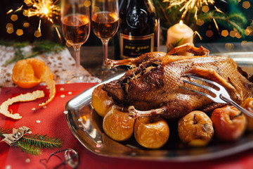 Baked duck with apples on the holiday table