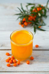 sea buckthorn tea on wooden surface