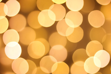 Defocused gold abstract christmas background. Golden and yellow circle background