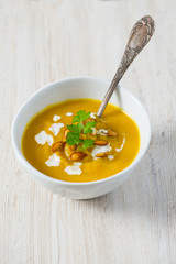 pumpkin soup on wooden surface