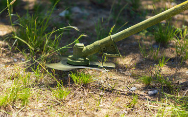 Mowing grass on the ground in the park