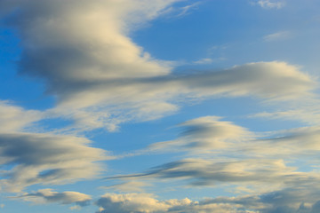 Clouds after rain before sunset as a background