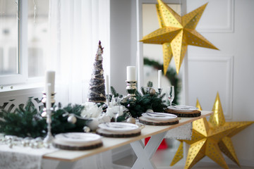 Table served for Christmas dinner in living room, close up view