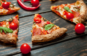 pizza on wood table with ingredients