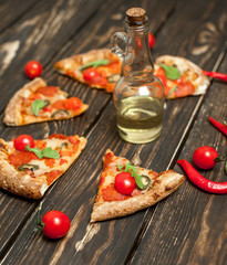 pizza on wood table with ingredients