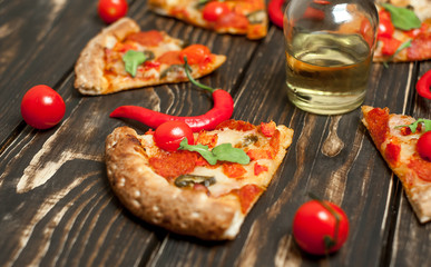 pizza on wood table with ingredients