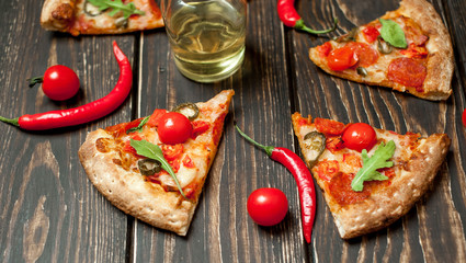 pizza on wood table with ingredients