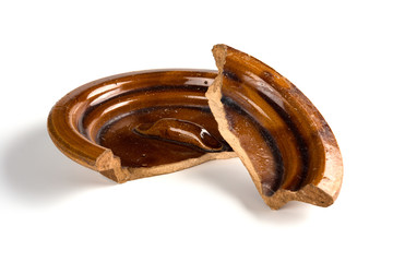 broken clay lid on a white background