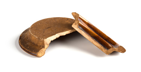broken clay lid on a white background