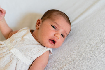 Face portrait of a newborn baby, calm and relaxed.