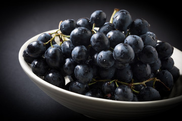 Dark grape in bowl.