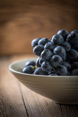 Dark grape in bowl.