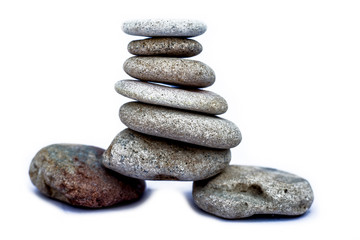A bunch of pebbles or small stones on each other isolated on white.