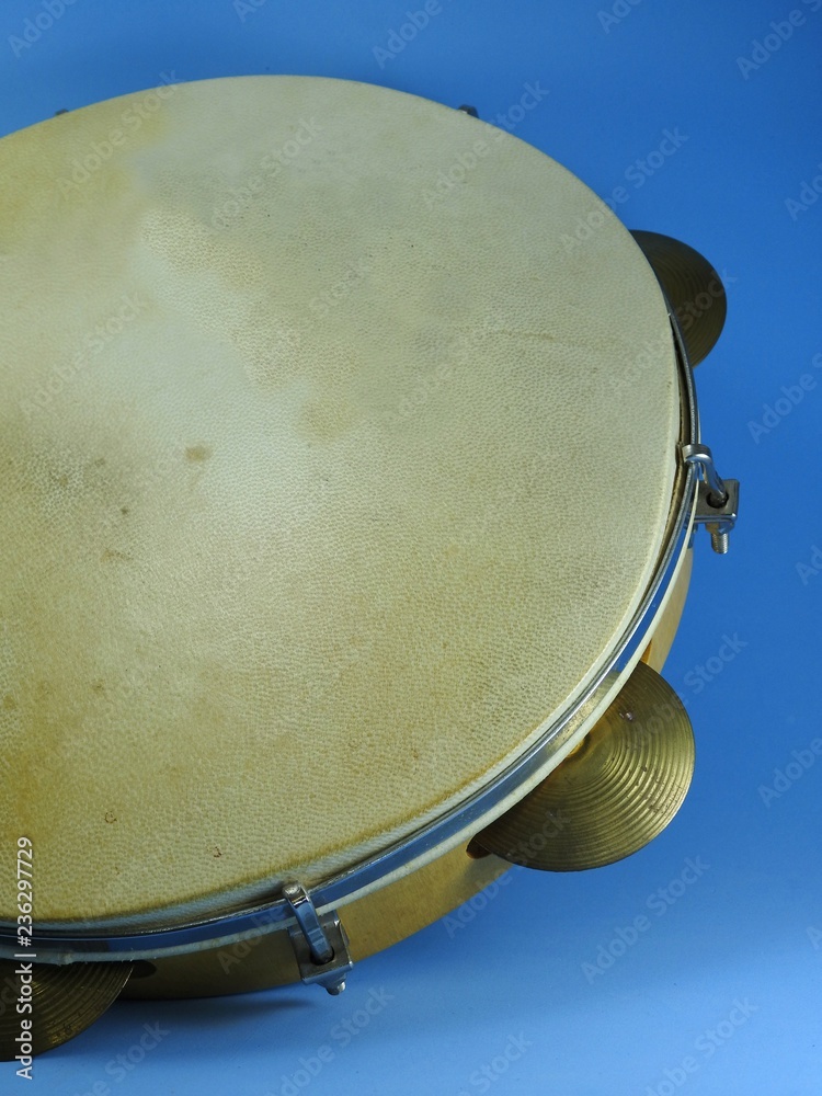 Wall mural Close-up of a Brazilian musical percussion instrument: pandeiro. It is is a type of hand frame drum and widely used to accompany samba and choro, two popular Brazilian rhythms.