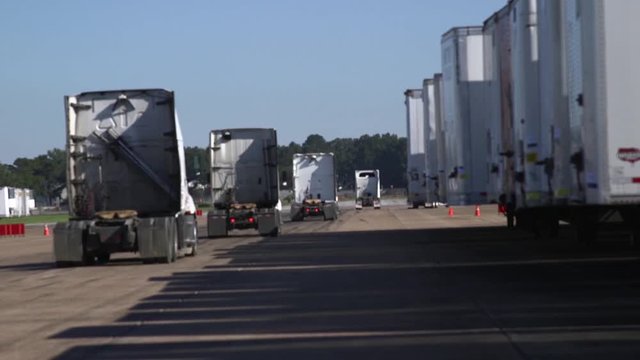 Trucks heads getting their containers at the container yard