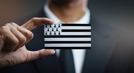 Businessman Holding Card of Brittany Flag