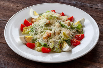 Caesar salad with eggs, parmesan, cherry tomatoes and garlic toasts.