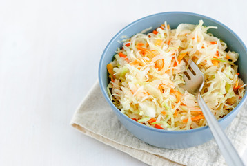 Bowl with sauerkraut and fork