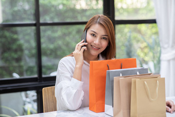 Fototapeta premium Beautiful Attractive Asian woman using smartphone for shopping online transform to online payment feeling so enjoy and happiness,Shopping Technology concept