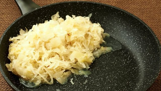 Fresh sauerkraut in frying pan
