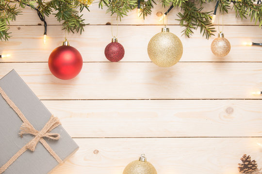 Christmas composition. Christmas gift. christmas ball. pine cones. fir branches on white wooden background. copy space