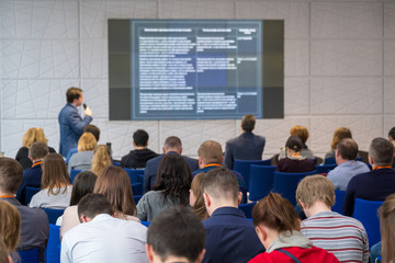 People attend business conference in the congress hall