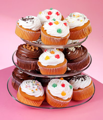 CAKE STAND WITH ICED CUPCAKES OR MUFFINS