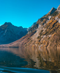 Fototapeta na wymiar Beautiful reflections at the famous Koenigssee-Bavaria-Germany