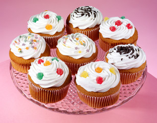 PLATE FULL OF ICED CUPCAKES OR MUFFINS