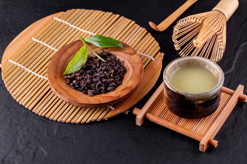 Top view of green tea matcha in a bowl on wooden surface