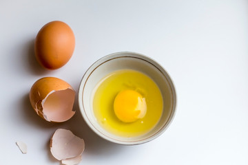 broken egg in a cup