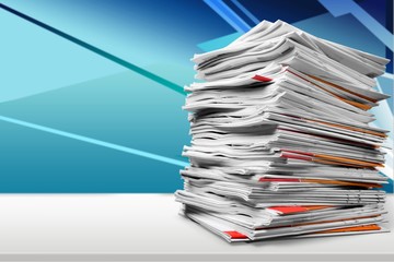 File folders with documents on white table