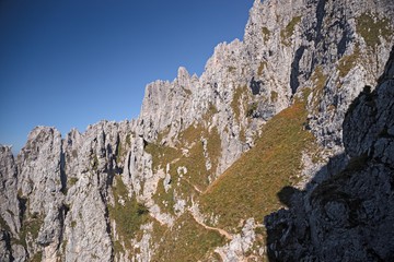 Panoramic view of the towers and spiers of the southern Grigna from the direct route, on a sunny autumn day.