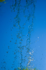 transparent falling water vertical flows, close up