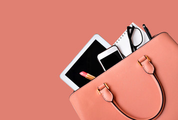 Business woman's everyday-life travel accessories flat lay on old rose background with formal old...