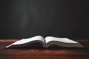  open bible  on wooden table